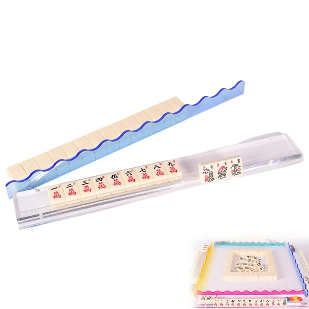 Sky blue Aspen rack with its wavy blue pusher angled away from the clear acrylic base and its row of tiles