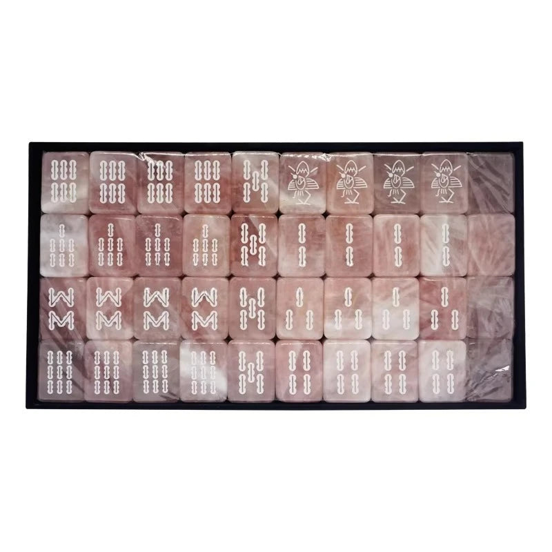 Tray of Celadon bamboo tiles under clear film, engraved white sticks and four bird tiles in the top row