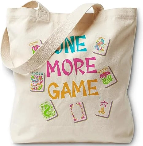 One More Game print: bright lettering among scattered tiles on a natural canvas Cotton tote