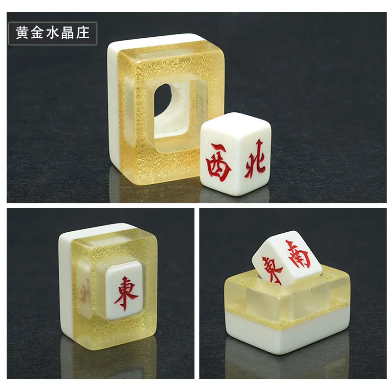 Gold acrylic holder in three views, one with the white cube seated in its window showing a red 東