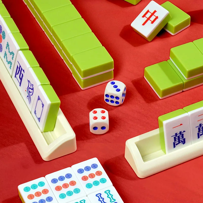 Fennel tiles standing in a cream rack on a red cloth, with lime green walls, a red dragon and dice