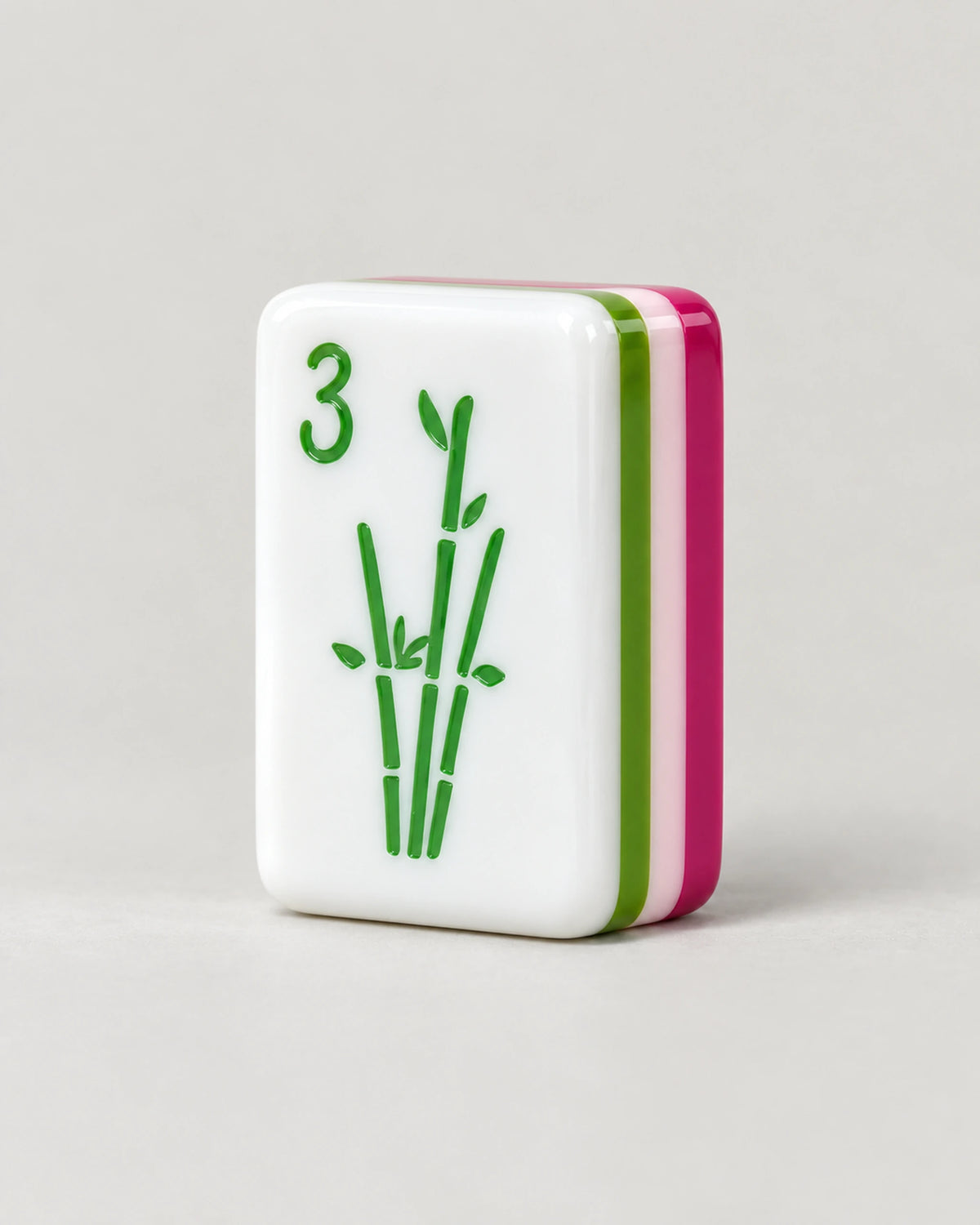 Fuchsia mahjong tiles, magenta backs, close-up of a single tile