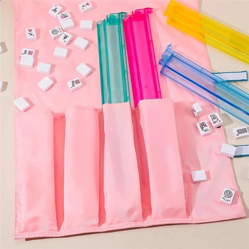 Green and pink acrylic racks slid into Heather pockets, with yellow and blue racks and tiles beside it