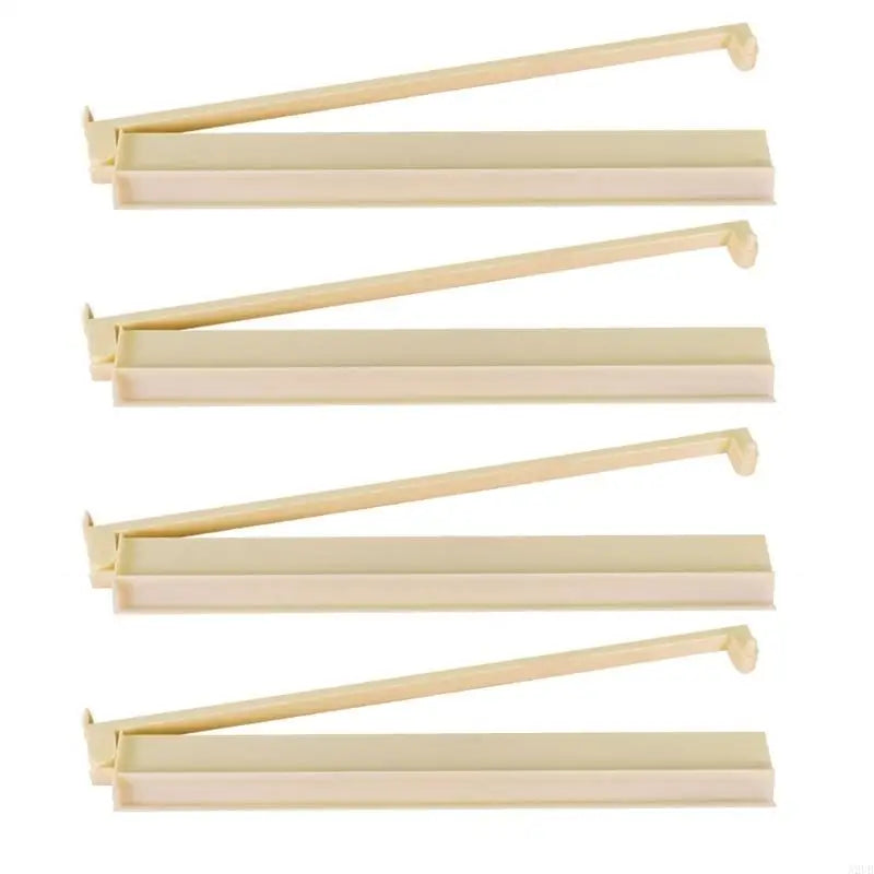 Cream version of the Larch set: four cream racks shown side by side with their pusher arms raised