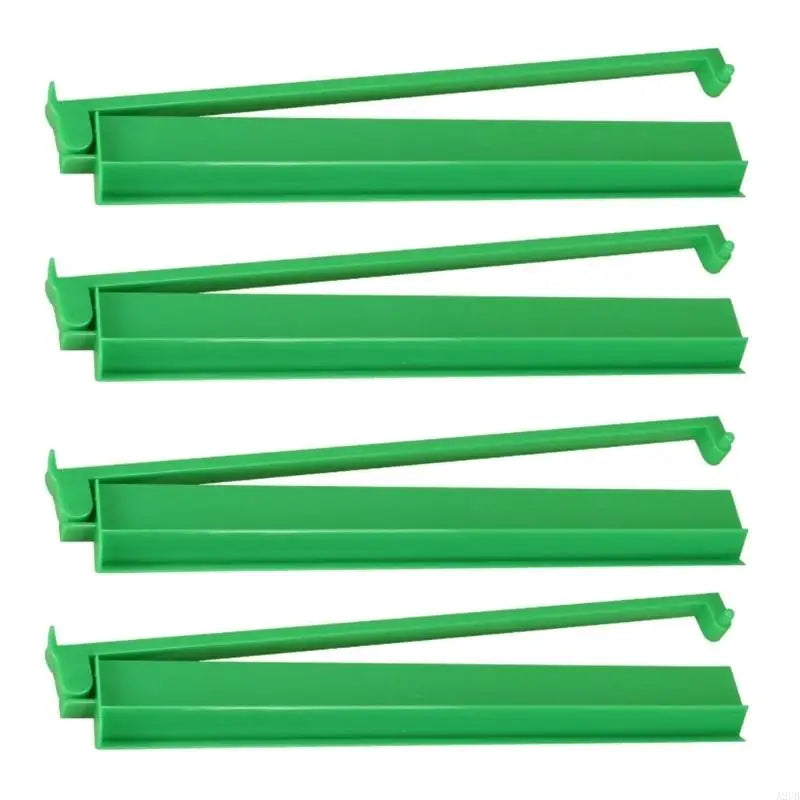 Green version of the Larch set: four solid green racks shown side by side with their arms raised