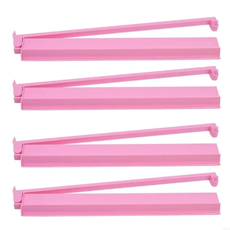 Pink version of the Larch set: four solid pink racks shown side by side with their arms raised