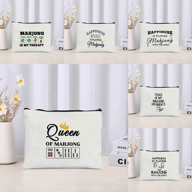 Six Linen pouches shown side by side on a shelf, one for each printed mahjong saying