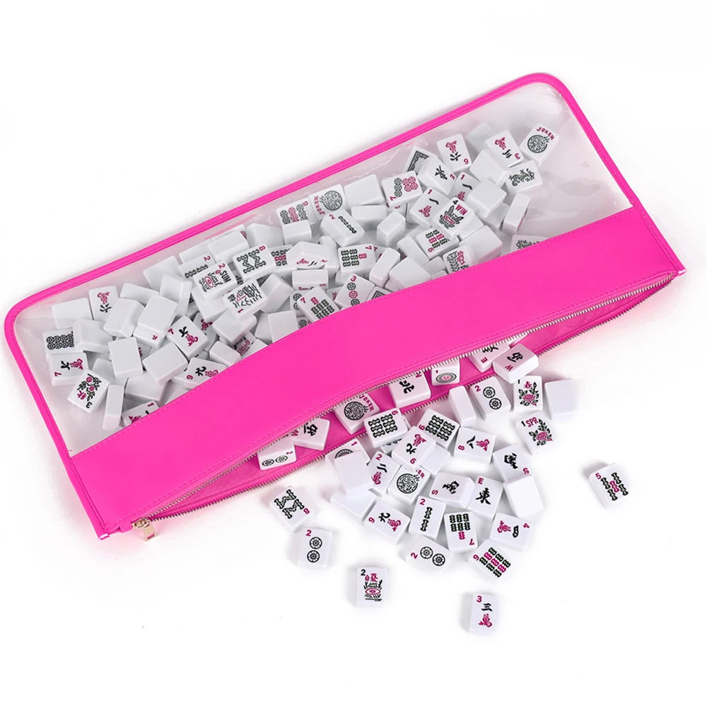 Hot pink Papyrus unzipped, tiles visible through the clear window and more spilling out of the top