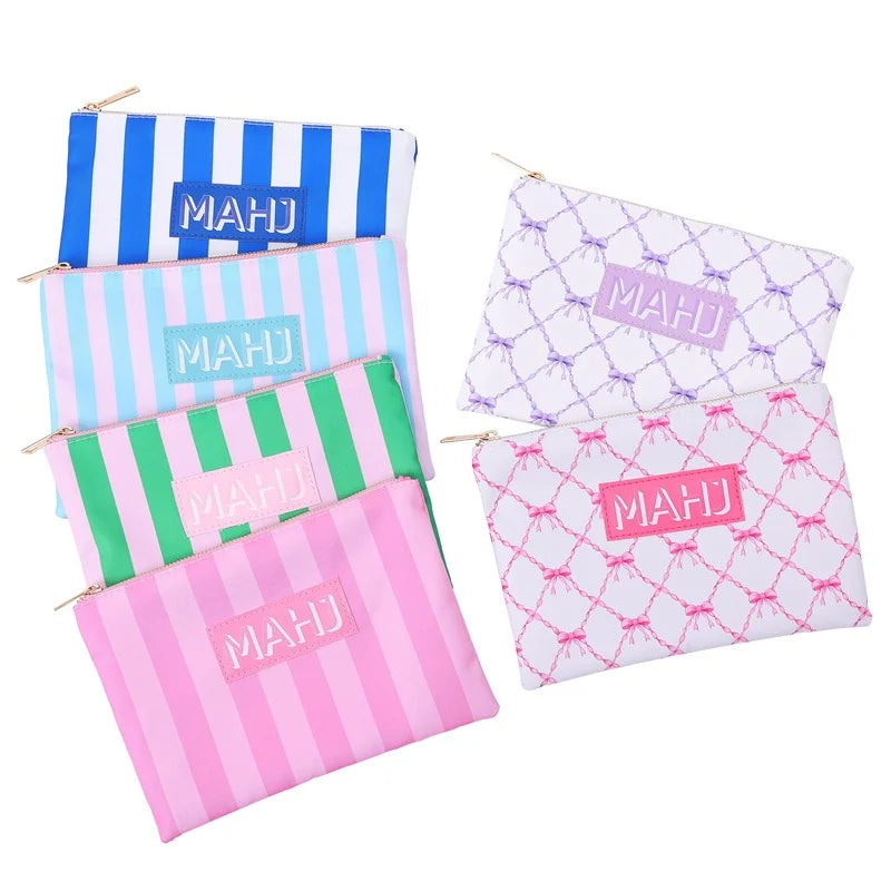 Six Raffia pouches fanned out: blue, pink, light blue and green stripes plus purple and pink bow prints