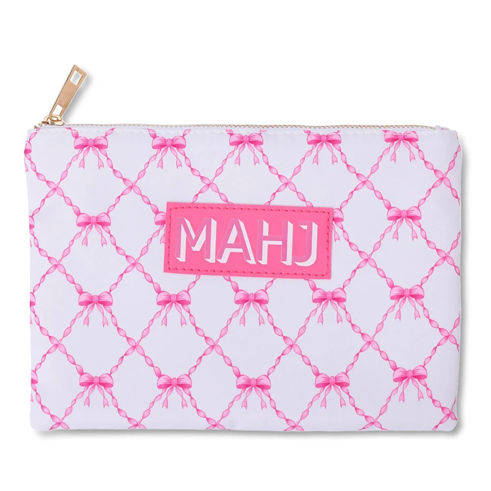 Raffia in white with a pink bow lattice print and a bright pink MAHJ patch
