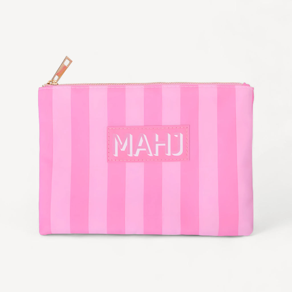 Raffia in all-pink stripes with a pink MAHJ patch and a gold-tone zipper along the top