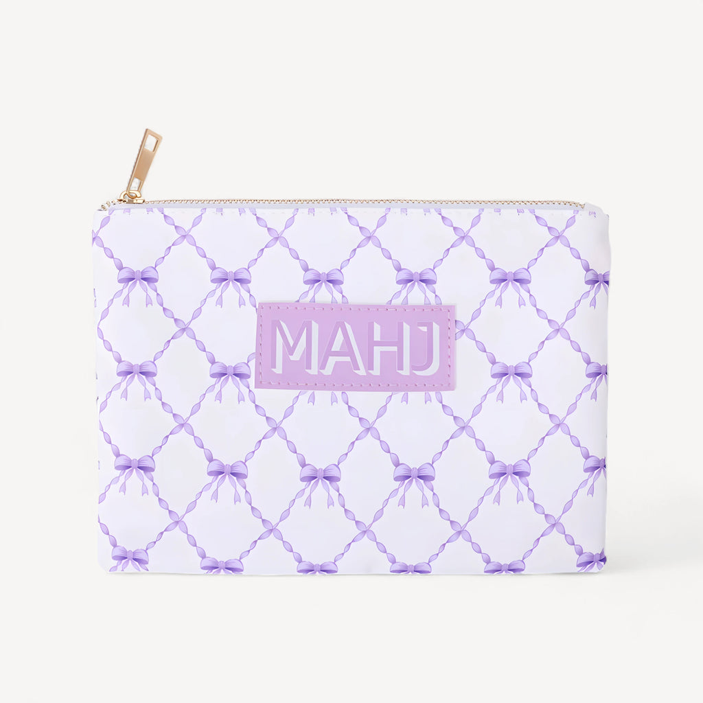 Raffia in white with a purple bow lattice print and a lilac MAHJ patch on the front