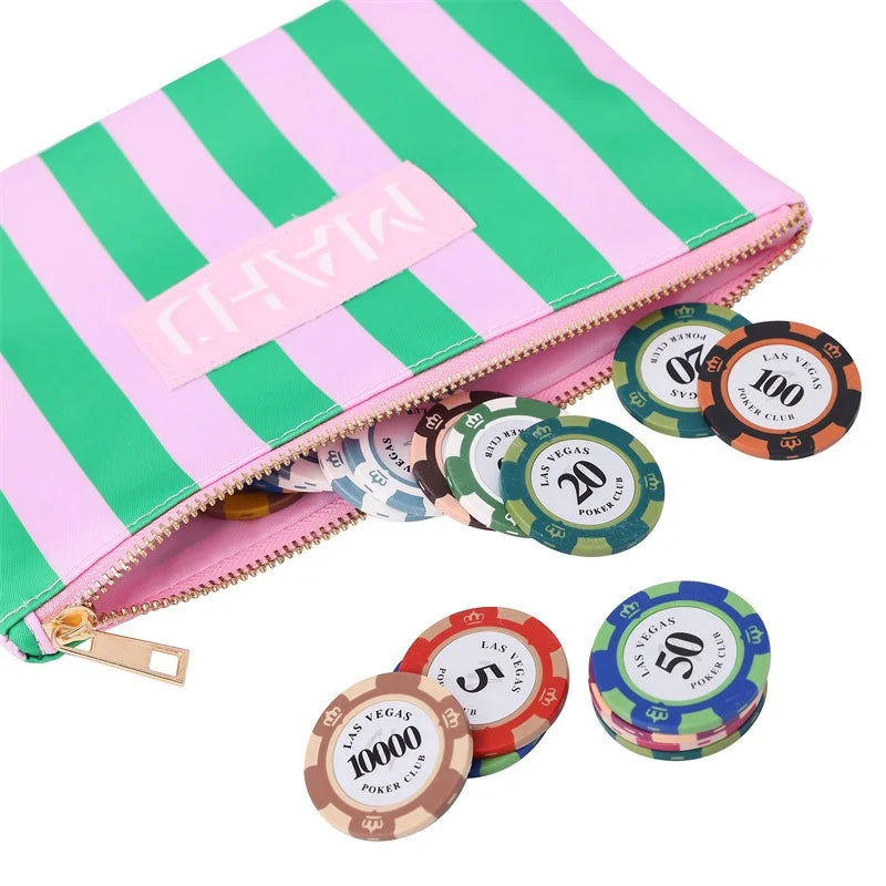 Raffia in pink and green stripes, open and spilling poker chips, with a pink lining inside