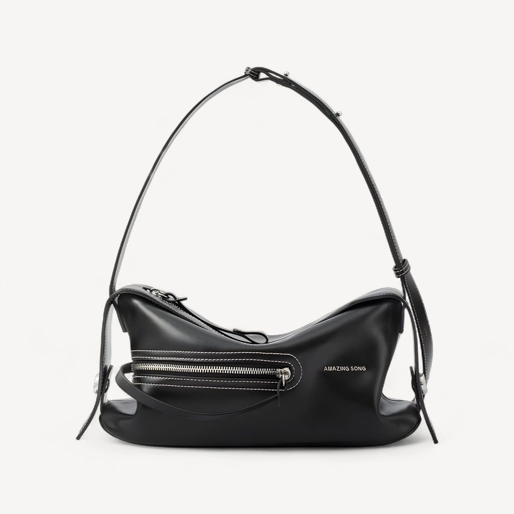 Black Sorrel from the front: curved crescent body, white contrast stitching, zip front pocket and buckled strap