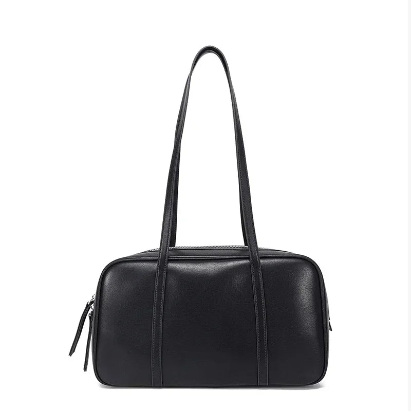 Mahjong handbag in black cowhide: a rectangular bowling bag with a zip top and two long shoulder straps