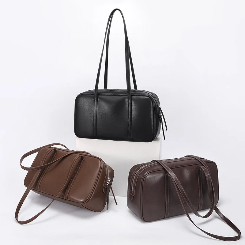 Teak in black, brown and coffee side by side, the same bowling bag shape in each color