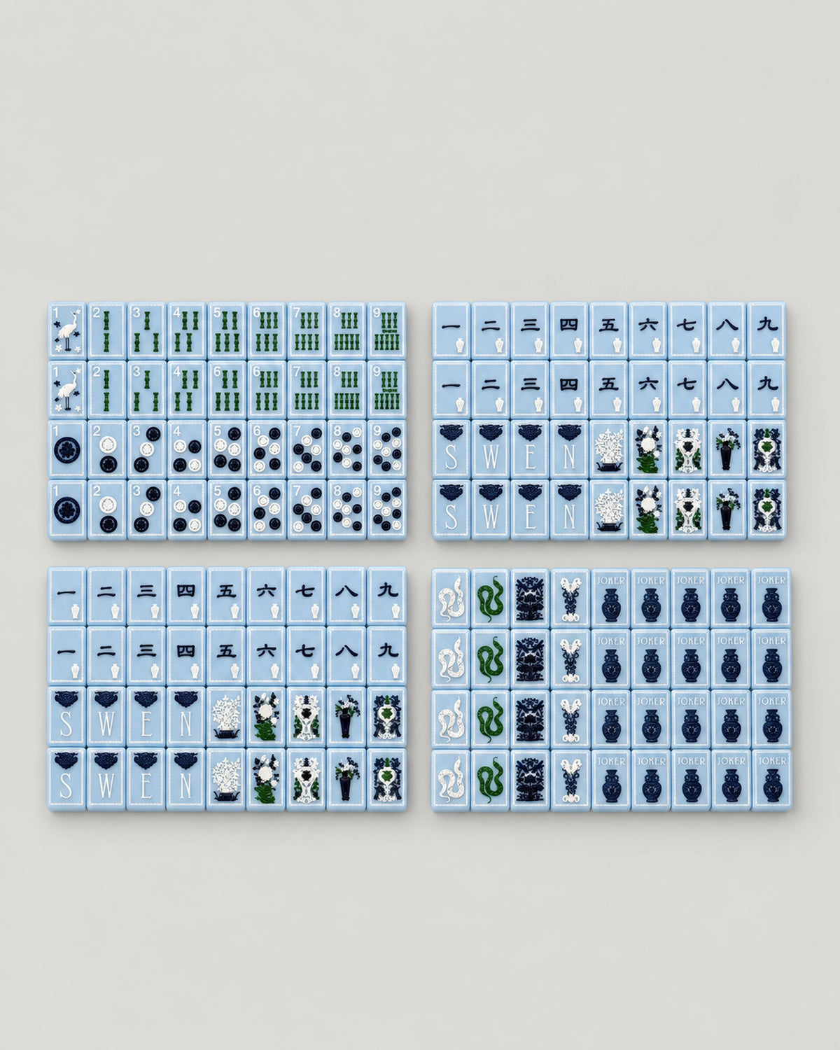 Full Willow set laid out in four blocks of light blue bamboo, dot, character, wind, flower and Joker tiles